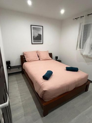 Postel nebo postele na pokoji v ubytování la villa des ô