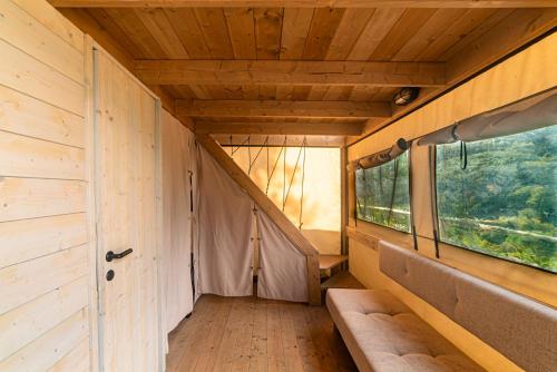 an inside view of a tiny house with a window at Delle Rose Camping & Glamping Village in Isolabona