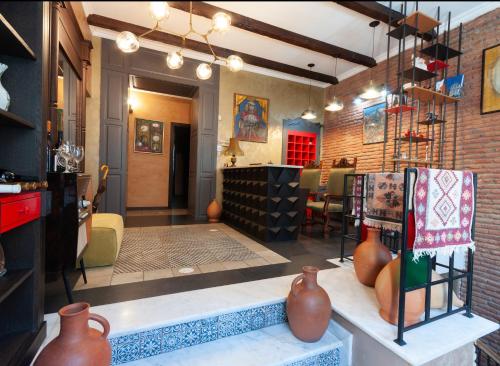 a store with vases on display in a room at Wine Story Hotel in Tbilisi City