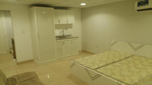 Kuchyň nebo kuchyňský kout v ubytování Ace Arena Resort