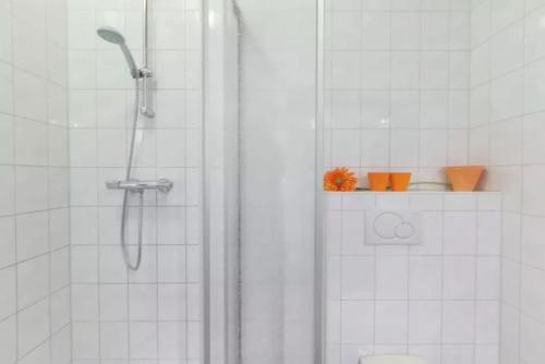 a bathroom with a shower with a glass door at Huis in de polder in Kamperland