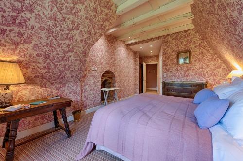 a bedroom with a large bed in a room at Château De La Bourdaisière in Montlouis-sur-Loire