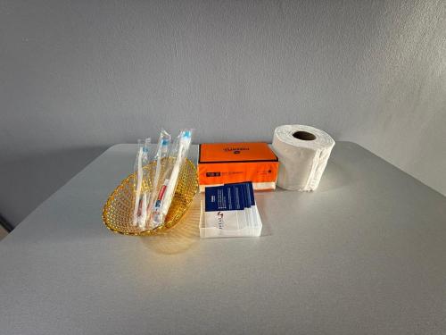 a table with toothbrushes and a roll of toilet paper at Bayu Beach Resort Port Dickson Santai PD Homestay 2 Bedroom Apartment in Port Dickson