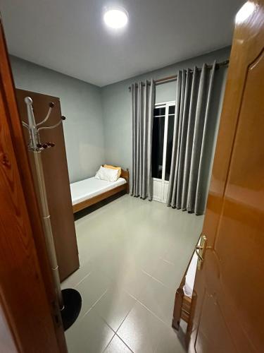 a small room with a bed and a window at Liam rooms in Tepelena Center in Tepelenë