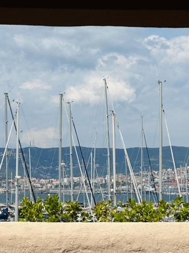 a bunch of sailboats are docked in a harbor at Apartment Gabriella in Muggia