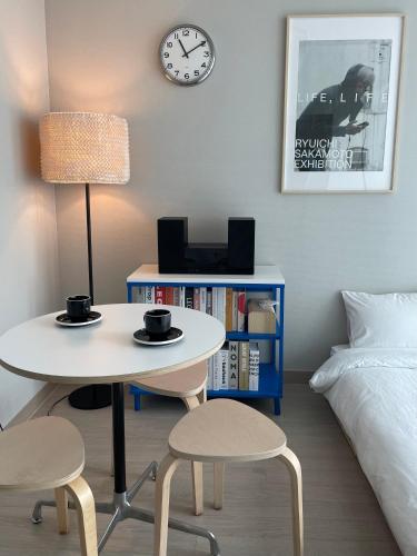 Ένα ή περισσότερα κρεβάτια σε δωμάτιο στο Incheon Berry the Hill Stay 인천송도