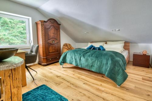 Ένα ή περισσότερα κρεβάτια σε δωμάτιο στο Penthouse mit Aussicht über den Wald