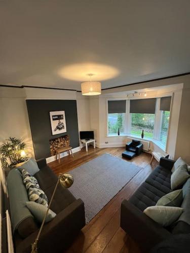 a living room with two couches and a living room with at West House Mews A in Dunston