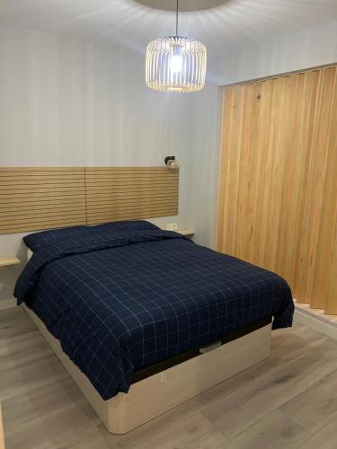 Postel nebo postele na pokoji v ubytování Lujo, urbano Céntrico