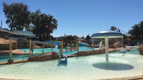 a water park with a water slide and a ride at Sable d'or in Le Grau-dʼAgde