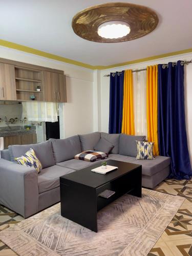 a living room with a couch and a coffee table at Rukiya's Haven in Nairobi