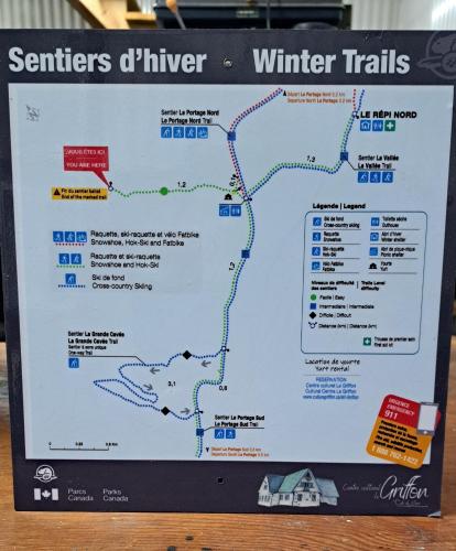 a map of the winter trails on a laptop computer at Yourtes Forillon - à 4km de marche 4km walk in Gaspé