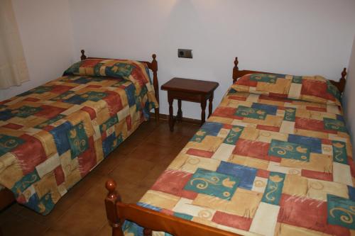 Katil atau katil-katil dalam bilik di Apartaments Les Dunes
