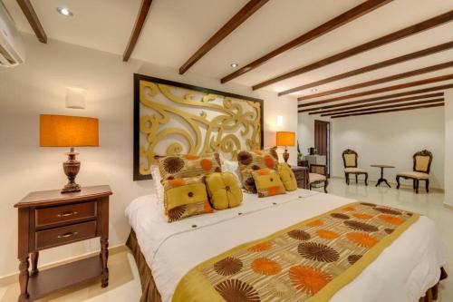 Postel nebo postele na pokoji v ubytování Hotel Dorado Plaza Boutique Calle del Arsenal