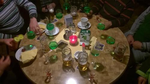 a group of people sitting around a table with glasses at Landhotel SONNENHOF MotorradKrauk in Ulrichsberg
