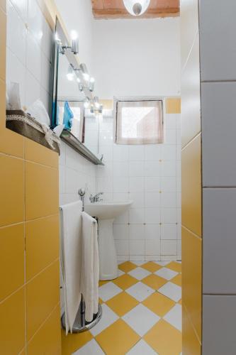 a bathroom with a sink and a toilet at Borgo Antico Residence in Certaldo