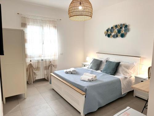 Ένα ή περισσότερα κρεβάτια σε δωμάτιο στο Suites Dreams Fiumicino Mare