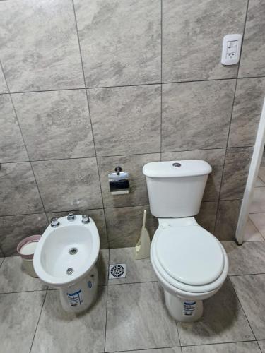 a bathroom with a toilet and a sink at Casa Alma San Pedro in San Pedro
