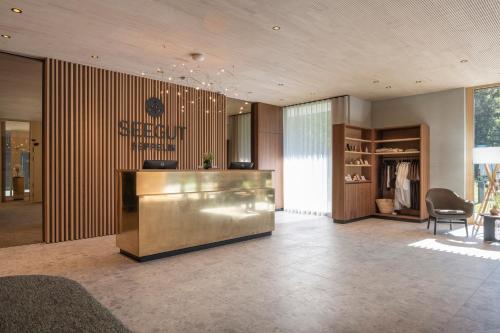 a lobby with a reception desk in a building at Seegut Zeppelin in Friedrichshafen