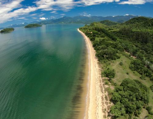 an aerial view of a beach and the ocean at Pousada Villa Aman in Paraty