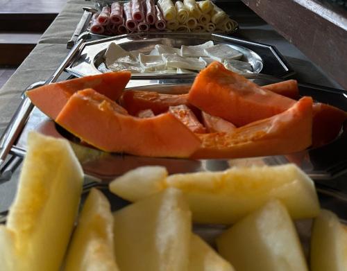 a tray of fruits and vegetables on a table at Pousada Villa Aman in Paraty