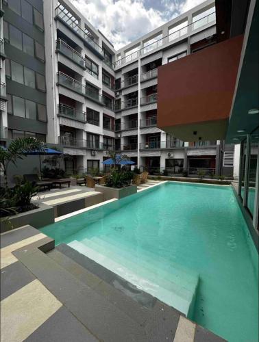 Πισίνα στο ή κοντά στο Stylish 1-Bedroom Apartment at Aqua View