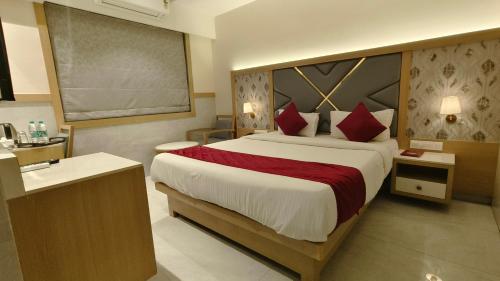 Hotel Prestige Residencyにあるベッド