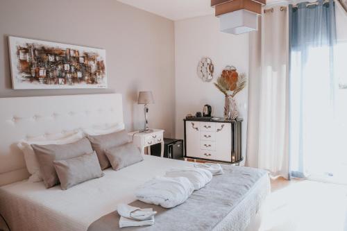 En eller flere senge i et værelse på Casa Morgados - Grândola Guesthouse