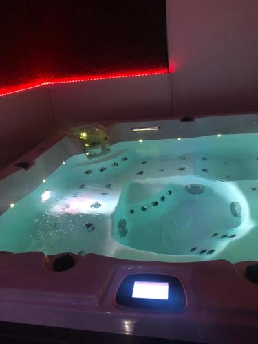 a bathtub with a faucet in a room at Villa del catalunya in Perpignan