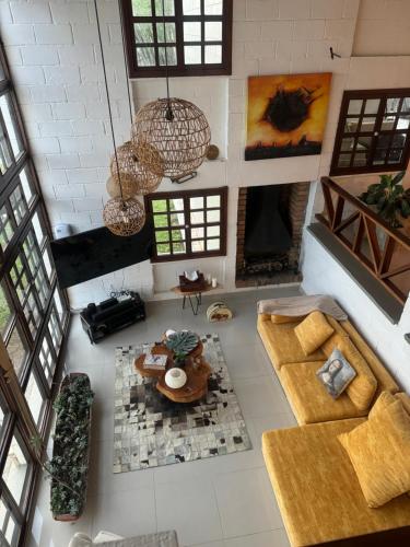 an overhead view of a living room with couches and a table at Hotel MACA lago calima in Calima