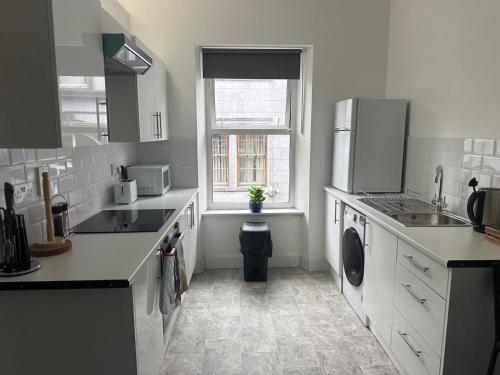 Dapur atau dapur kecil di Cook street accommodation
