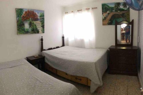 Postel nebo postele na pokoji v ubytování Villa Cordero - Las calderas baní