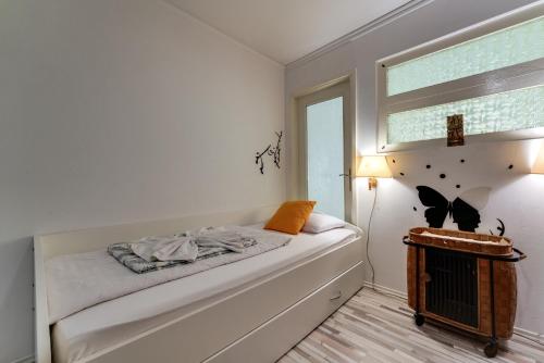 Postel nebo postele na pokoji v ubytování B&B Apartments Coli apartments Afrodita & Antonia