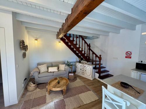 a living room with a couch and a table at Villa Tité in Oviedo