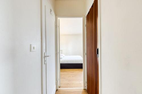 Katil atau katil-katil dalam bilik di Logement cosy à 2 min de la gare