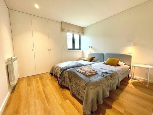 a bedroom with a large bed in a room at Marinhas Nature in Marinhas