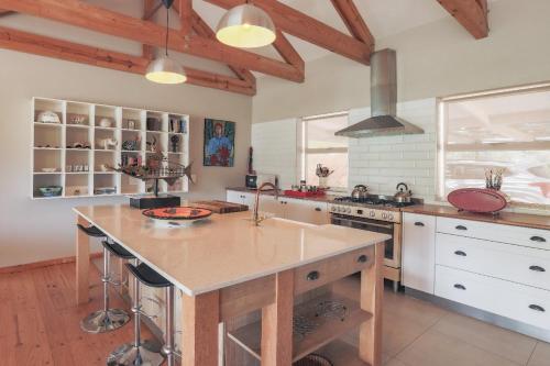 a kitchen with a large island in the middle of it at Robertson Stays in Robertson