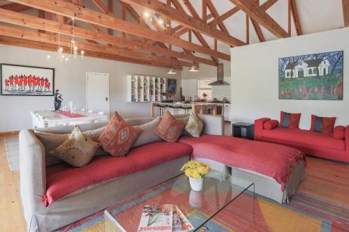 a living room with a couch and a table at Robertson Stays in Robertson
