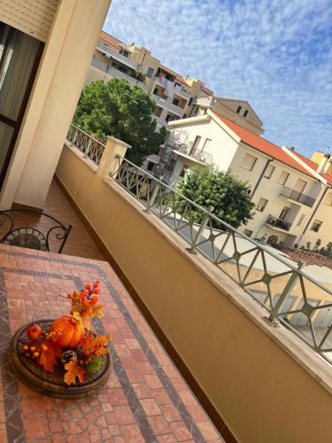 a pumpkin sitting on a table on a balcony at Alghero Heart in Alghero