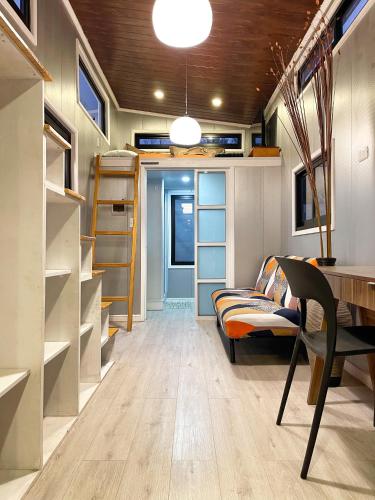 Гостиная зона в Tiny House Premium con vistas panorámicas y cercanía a la playa - Pet Friendly