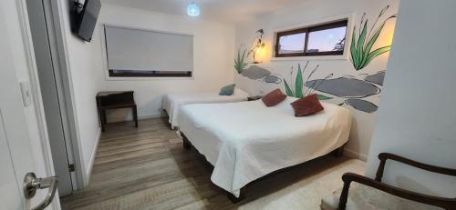 Postel nebo postele na pokoji v ubytování HOSTAL LA MODERNA