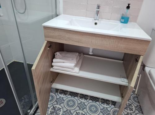 a bathroom with a sink and a shower at La Casona Santander Centro in Santander