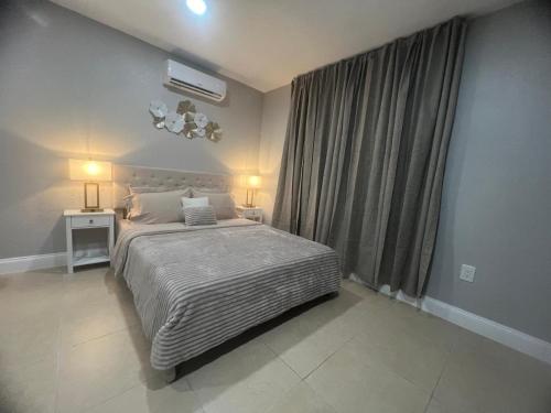 a bedroom with a large bed and a window at Peaceful Florida Studio in Lakeland