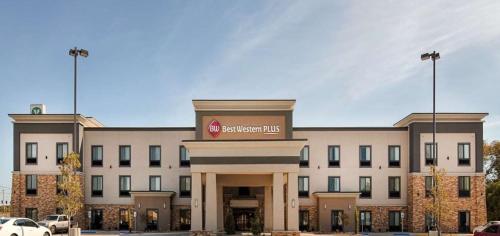 a large building with a sign on the front of it at Best Western Plus Ardmore Inn & Suites in Ardmore