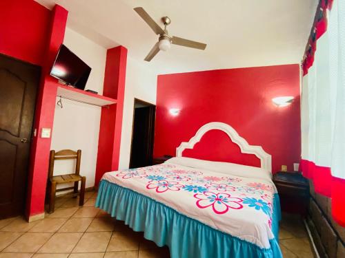 Cama o camas de una habitación en Hotel Sta Cruz Oaxtepec