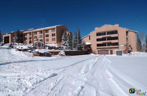 a snow covered street in front of a building at Royal Queen Suite Pool-Spa Ski-in out Gym, Sauna, Laundry, BBQ in Brian Head