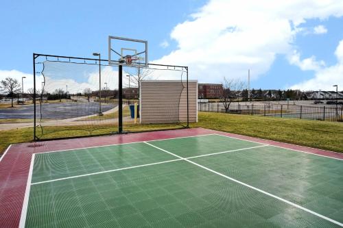 a tennis court with a basketball hoop at Residence Inn by Marriott Dayton Beavercreek in Beavercreek