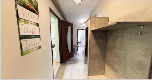 a hallway of a house with a staircase at UROCZYSKO POD LASEM in Nickelswalde