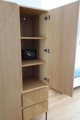 a cupboard with a box in it in a room at La Dolce Vita Civitavecchia in Civitavecchia