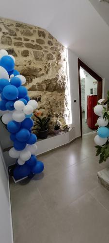 a bunch of blue and white balloons in a room at All inBasilicata Bed & Breakfast in Baragiano